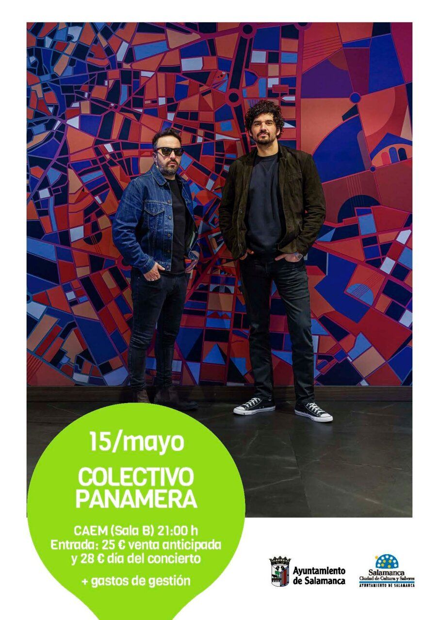 Dos hombres posando frente a un mural colorido en Salamanca