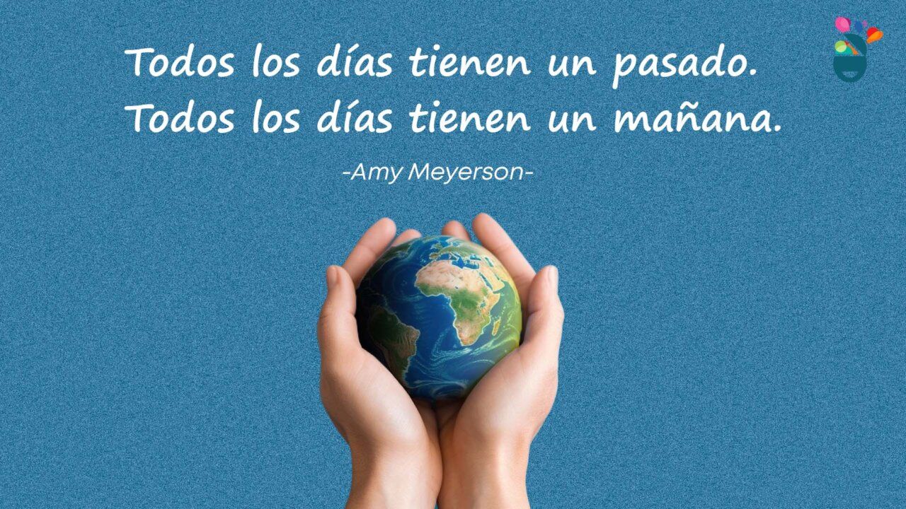 Manos sosteniendo un globo terráqueo con una cita inspiradora.