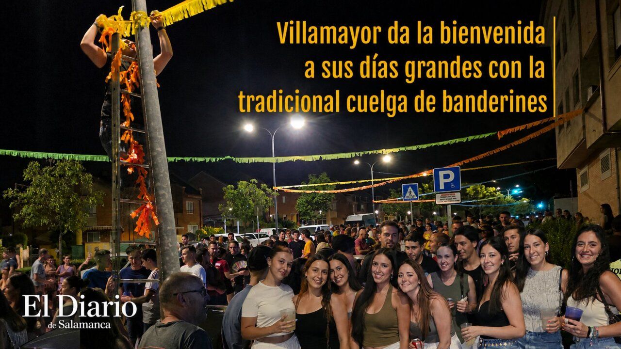 Participantes en la cuelga de banderines en Villamayor durante las fiestas de verano.